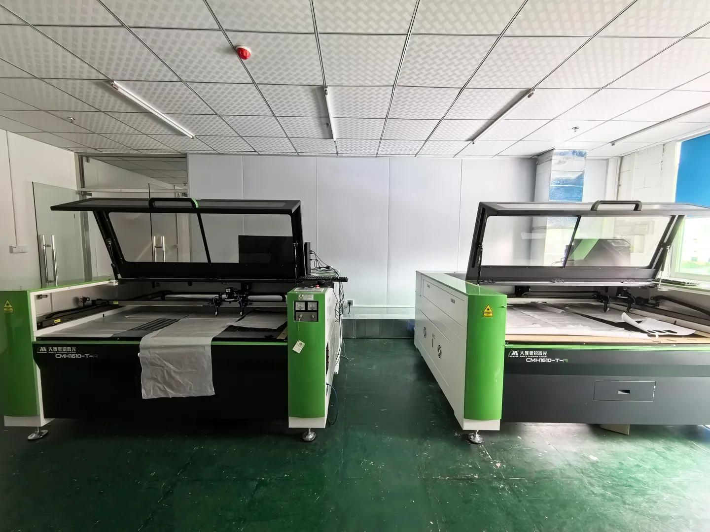 Two laser cutting machines used for patch and panel cutting in-house